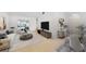 Bright living room with hardwood floors, contemporary furniture, and access to backyard at 5344 Lowell Ave, Spring Hill, FL 34609
