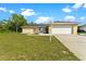 Ranch-style home with attached garage and yard at 5344 Lowell Ave, Spring Hill, FL 34609