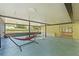Outdoor patio featuring a hot tub and hammock at 5344 Lowell Ave, Spring Hill, FL 34609