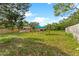 Spacious backyard with shed, seating, and house view at 5344 Lowell Ave, Spring Hill, FL 34609