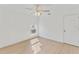 Well lit bedroom with ceiling fan, window, and light laminate flooring at 5344 Lowell Ave, Spring Hill, FL 34609