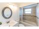 Clean bathroom with updated tile, bathtub, and vanity at 5344 Lowell Ave, Spring Hill, FL 34609
