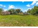 Large backyard with a shed and partial view of house at 5344 Lowell Ave, Spring Hill, FL 34609