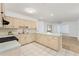 Updated kitchen with light wood cabinets and a breakfast bar at 5344 Lowell Ave, Spring Hill, FL 34609