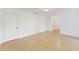 Spacious bedroom with light laminate flooring, and ample closet space at 5344 Lowell Ave, Spring Hill, FL 34609