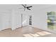 Light and airy bedroom with wood-look floors, dual windows, and closet at 5344 Lowell Ave, Spring Hill, FL 34609