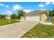 Attached garage with a large driveway at 5344 Lowell Ave, Spring Hill, FL 34609