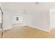 Open dining area with hardwood floors and access to the kitchen at 5344 Lowell Ave, Spring Hill, FL 34609