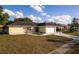 Single-story house with attached garage and well-maintained lawn at 5344 Lowell Ave, Spring Hill, FL 34609