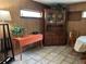 Cozy dining area with wood hutch and tile floors at 8471 52Nd N Ln, Pinellas Park, FL 33781