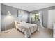 Bright bedroom with carpeted floors and window at 9209 Seminole Blvd # 75, Seminole, FL 33772