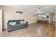 Open living room with hardwood floors and kitchen view at 9209 Seminole Blvd # 75, Seminole, FL 33772