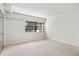 Large bedroom with a window and carpet at 9209 Seminole Blvd # 75, Seminole, FL 33772