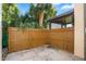 Private patio with wooden fence and adjacent landscaping at 9209 Seminole Blvd # 75, Seminole, FL 33772