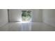 Bright living room with sliding glass doors leading to backyard at 10024 Heathcliff St, Spring Hill, FL 34608