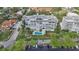 Aerial view of condo building with pool and parking at 1050 Riverside Dr # A201, Palmetto, FL 34221