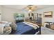 Serene bedroom with queen-size bed and built-in shelving at 1050 Riverside Dr # A201, Palmetto, FL 34221