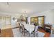 Spacious dining area with hardwood floors and a view into the kitchen at 1050 Riverside Dr # A201, Palmetto, FL 34221