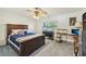 Comfortable bedroom with a queen-size bed and home office at 1050 Riverside Dr # A201, Palmetto, FL 34221