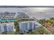 Aerial view of a waterfront condo building near a marina at 1050 Riverside Dr # A201, Palmetto, FL 34221