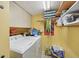 Functional laundry room with washer, dryer, and ample storage at 1050 Riverside Dr # A201, Palmetto, FL 34221
