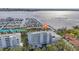 Aerial view of waterfront condo building with marina and boats at 1050 Riverside Dr # A201, Palmetto, FL 34221