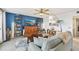 Bright living room with comfy seating, large TV, and access to a balcony at 1050 Riverside Dr # A201, Palmetto, FL 34221
