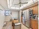 Kitchen with stainless steel appliances, wood cabinets, and island at 1050 Riverside Dr # A201, Palmetto, FL 34221