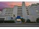 Condo building exterior at sunset, featuring a grand entrance at 1050 Riverside Dr # A201, Palmetto, FL 34221