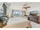 Bright bedroom with king-size bed, balcony access, and ample closet space at 1050 Riverside Dr # A201, Palmetto, FL 34221