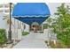 Condo building entrance with awning and walkway at 1050 Riverside Dr # A201, Palmetto, FL 34221