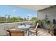 Enjoy water views from this balcony, complete with a bistro table and chairs at 1050 Riverside Dr # A201, Palmetto, FL 34221