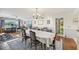 Open concept dining area with hardwood floors and view to office and balcony at 1050 Riverside Dr # A201, Palmetto, FL 34221