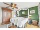 Main bedroom with king-size bed, and large wooden dresser at 1050 Riverside Dr # A201, Palmetto, FL 34221