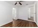 Bright bedroom with wood-look floors and ceiling fan at 106 E Calhoun St, Plant City, FL 33563