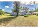 Blue house with a metal roof, deck, and large yard at 106 E Calhoun St, Plant City, FL 33563