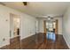 Living room with hardwood floors, access to bathroom and kitchen at 1102 Tarridon Ct, Dunedin, FL 34698