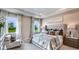 Spacious main bedroom with plush bedding and large windows at 18006 Tavernside Trl, Lakewood Ranch, FL 34211