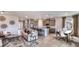 Open concept kitchen and living area with island and stainless steel appliances at 18006 Tavernside Trl, Lakewood Ranch, FL 34211
