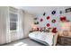 Bedroom with daybed, vinyl record wall art, and plenty of natural light at 18006 Tavernside Trl, Lakewood Ranch, FL 34211