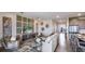 Open living room with kitchen and dining views, stylish furniture and decor at 18006 Tavernside Trl, Lakewood Ranch, FL 34211
