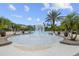 A circular wading pool with a central fountain feature at 2811 Maple Brook Loop, Lutz, FL 33558