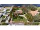 Expansive waterfront property showcasing generous lot dimensions, tropical landscaping, and private pool at 306 Blanca Ln, Tampa, FL 33606