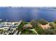 Amazing aerial view of home showcasing bay access and beautiful backyard pool at 306 Blanca Ln, Tampa, FL 33606