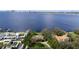 Picturesque aerial view of luxurious waterfront homes with pools and well-manicured lawns at 306 Blanca Ln, Tampa, FL 33606
