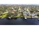 Stunning aerial view of waterfront homes with private docks and lush landscaping in a desirable neighborhood at 306 Blanca Ln, Tampa, FL 33606