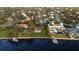 Gorgeous aerial view of waterfront homes with lush landscaping, pools, and private boat docks at 306 Blanca Ln, Tampa, FL 33606