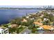 Aerial view of waterfront homes with city skyline in the background at 306 Blanca Ln, Tampa, FL 33606