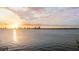 Stunning water view at sunset, with a golden glow reflecting on the city skyline at 306 Blanca Ln, Tampa, FL 33606