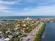 Stunning aerial view of property near the ocean and local attractions at 3302 E Maritana Dr, St Pete Beach, FL 33706